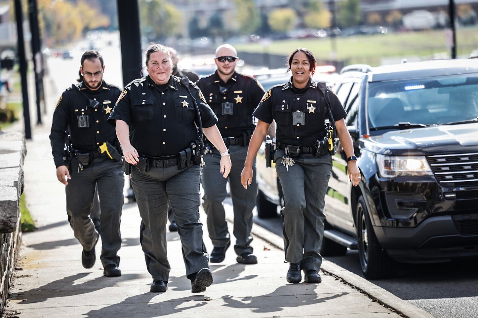 Montgomery County Sheriff's deputies joined officers from multiple jurisdictions at Miami Valley Hospital Tuesday, Oct. 31, 2023, to greet Clayton officer Cody Cecil who was released after he was shot last week serving a warrant. JIM NOELKER/STAFF