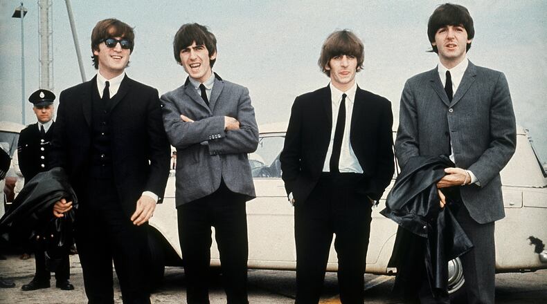 FILE - The Beatles, from left, John Lennon, George Harrison, Ringo Starr and Paul McCartney appear in Liverpool, England on July 10, 1964, for the premiere of their movie "A Hard Day's Night." Dayton Live presents Twist & Shout: The Music Of The Beatles March 8 at the Schuster Center.  (AP Photo, File)