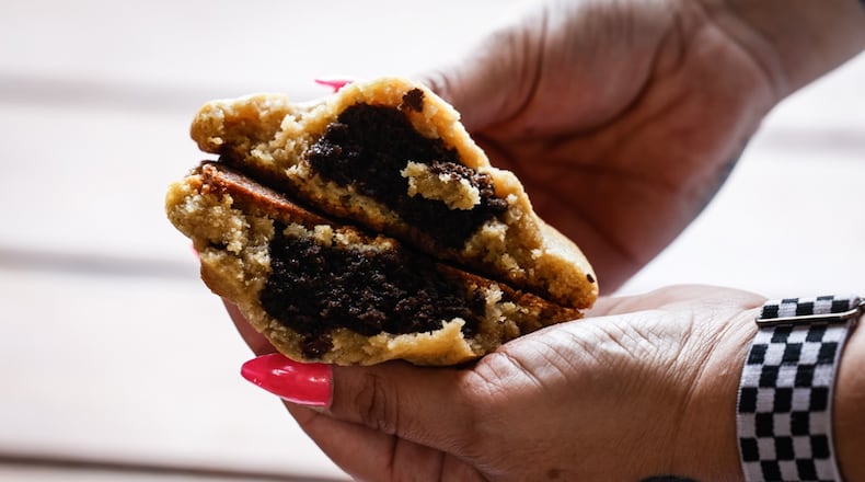 Dayton native Casie Morris rebranded her stuffed cookie business at the beginning of the year after customers continuously called her “The Cookie Girl.” JIM NOELKER/STAFF