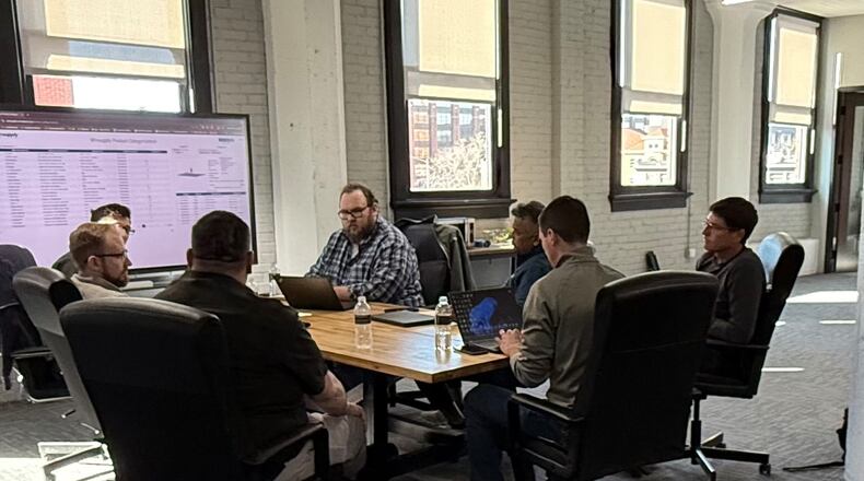 Winsupply Inc. and Mined XAI teams work together. Winsupply has acquired a minority stake in Dayton AI company Mined XAI. CONTRIBUTED/MINED XAI