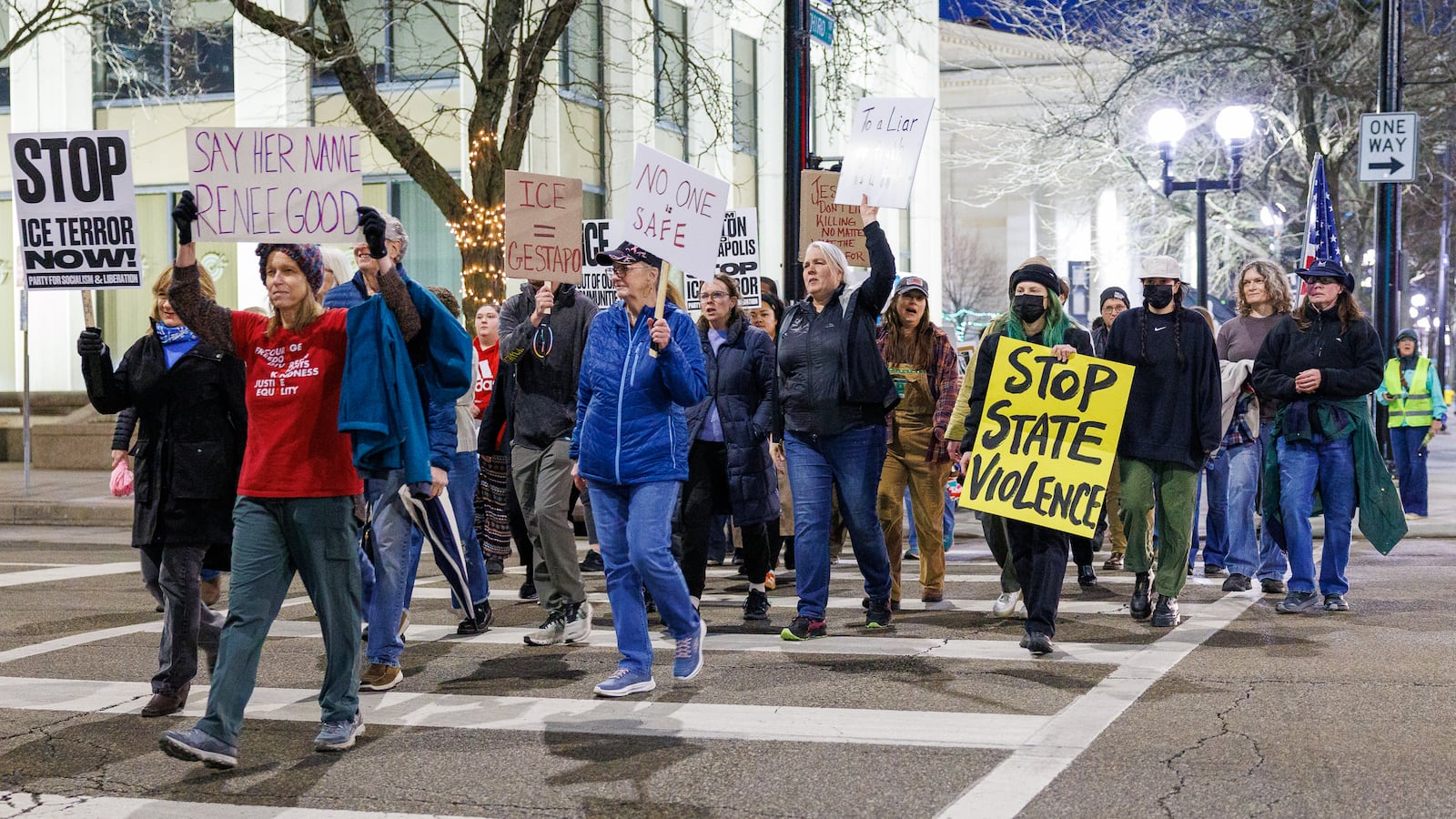 Demonstrators cross North Ludlow Street while marching on West Third Street near Courthouse Square on their way to Walter H. Rice Federal Building on Thursday, Jan. 8 during the Dayton to Minneapolis Stop ICE Terror protest. The protest was organized by a local chapter of the Party for Socialism and Liberation. BRYANT BILLING/STAFF