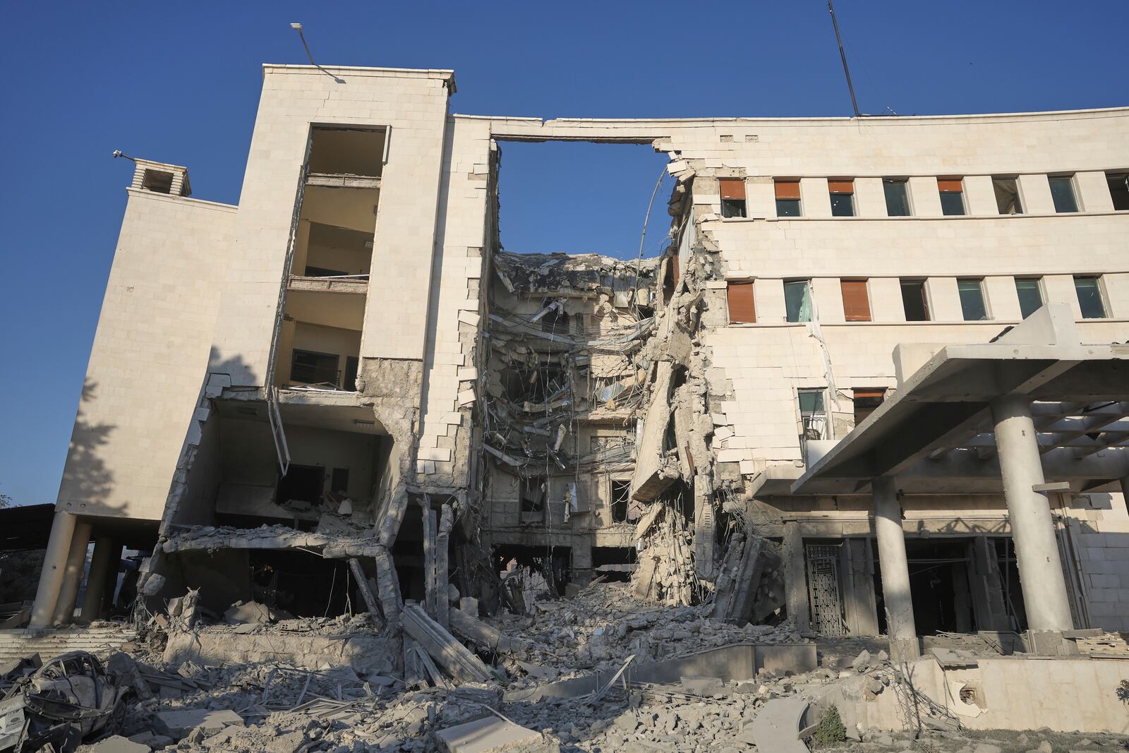 The Syrian Defense Ministry building sits heavily damaged after alleged Israeli airstrikes in Damascus, Syria, Wednesday, July 16, 2025. (AP Photo/Ghaith Alsayed)