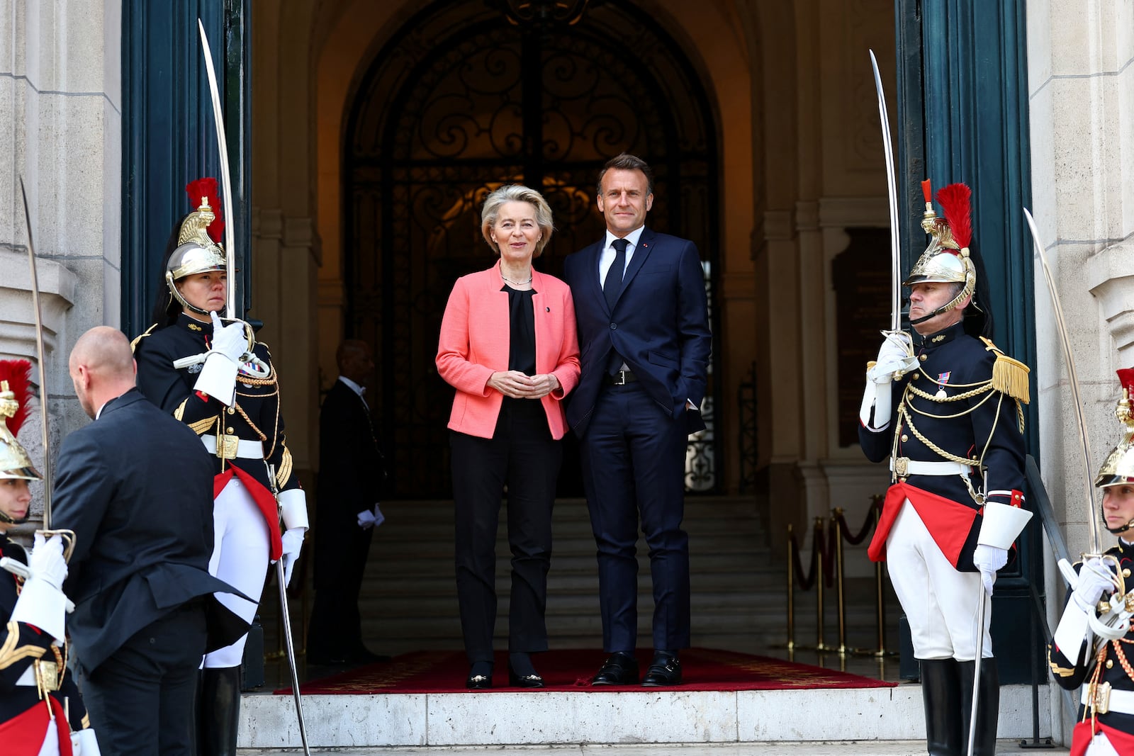 French President Emmanuel Macron welcomes European Commission President Ursula Von der Leyen as she arrives at the "Choose Europe for Science" event, to encourage researchers and scientists from all over the world to practice in Europe, at the Sorbonne University in Paris, Monday, May 5, 2025.(Gonzalo Fuentes/Pool via AP)