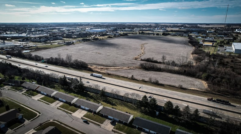Hobart Institute bought this large farm field on the west side of Interstate 75 (foreground) in Troy. The Pella Window business (right edge of photo) is to the north of the parcel, and the Towne Park office complex is to the south. Hobart bought the acreage for future development. JIM NOELKER/STAFF