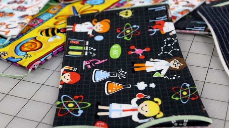 Dayton Sewing Collaborative volunteers  in homes around  the community have made hundreds of reusable face masks for local organizations that need them as worries mount of the coronavirus. AMELIA ROBINSON/STAFF