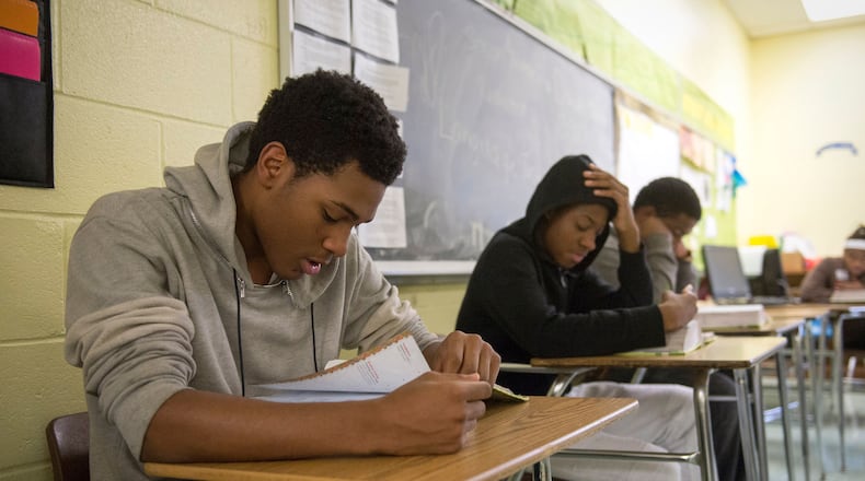 December 14, 2016 - Senior Michael Stewart, left, reads aloud from Geoffrey Chaucer's The Canterbury Tales in teacher Melonee Griggs' English IV British Literature class at Booker T. Washington High School. (Brandon Dill/Special to The Commercial Appeal)