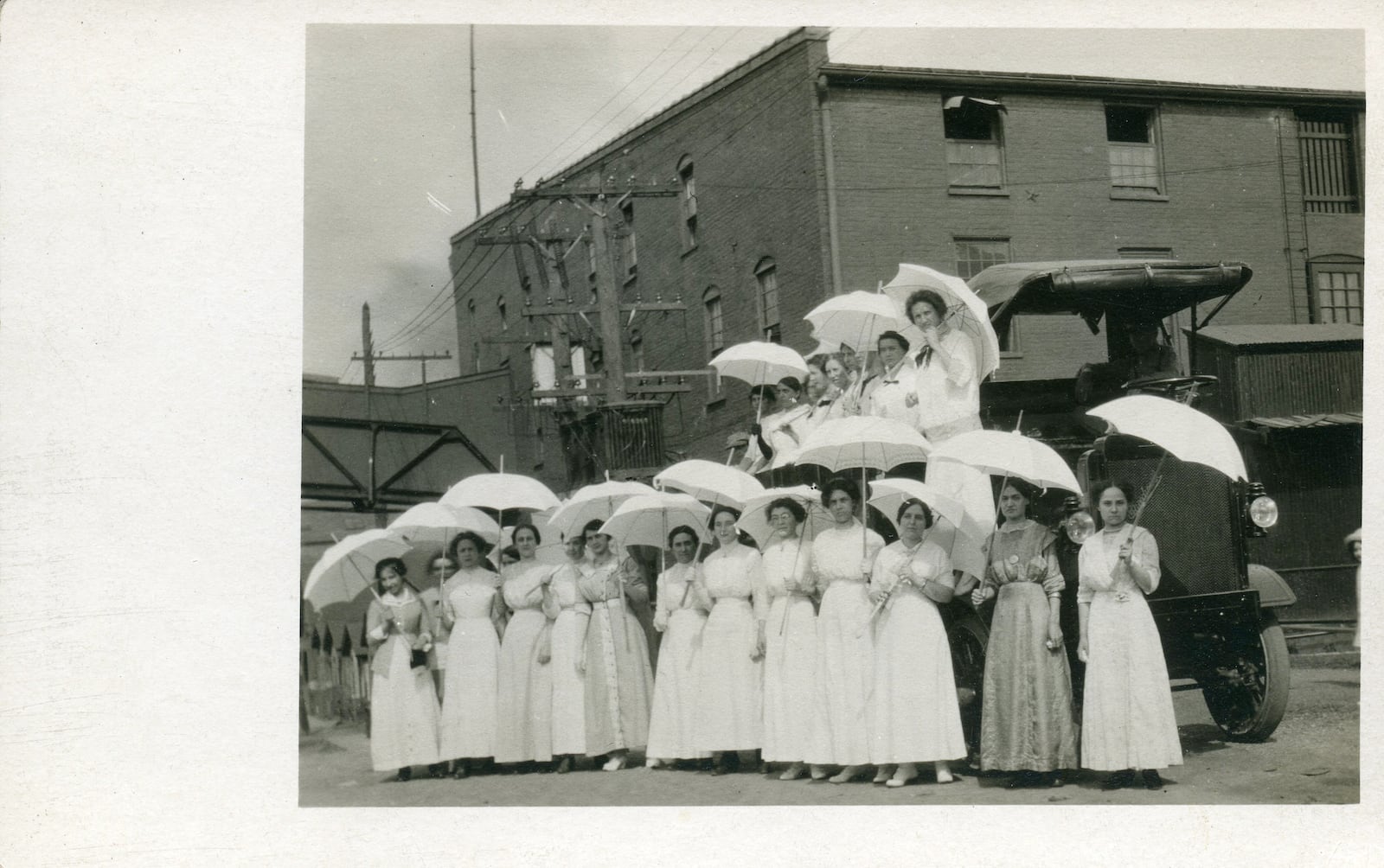 An early photo of the Front Street Buildings, estimated to be from 1918-1919.  "The women in white worked at Front Street and we believe them to be suffragettes," said Richard Lundin, who is working on a book about Front Street history. CONTRIBUTED