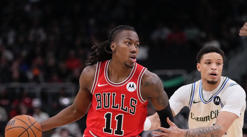 Chicago Bulls' Ayo Dosunmu gets past Milwaukee Bucks' Amir Coffey during the first half of an NBA basketball game Tuesday, Feb. 3, 2026, in Milwaukee. (AP Photo/Morry Gash)