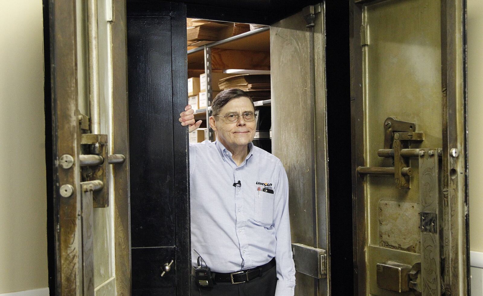 Jeffre L. Peace, president and CEO of Lincoln Storage and Moving, at the vault entrance inside their historic Bimm Fireproof Storage building. TY GREENLEES / STAFF