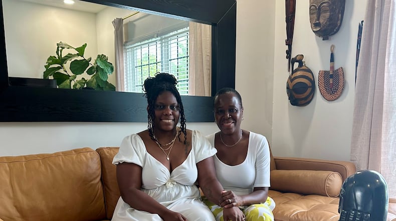 Shannon (left) and April Alford-Barclay relax in their living. Photo by Robin McMacken