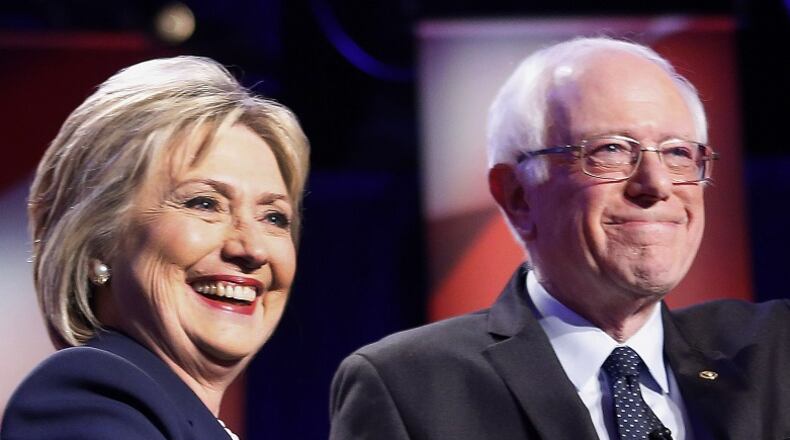Democratic presidential candidates Hillary Clinton, left, and Sen. Bernie Sanders, I-Vt. (AP Photo/Jim Cole)