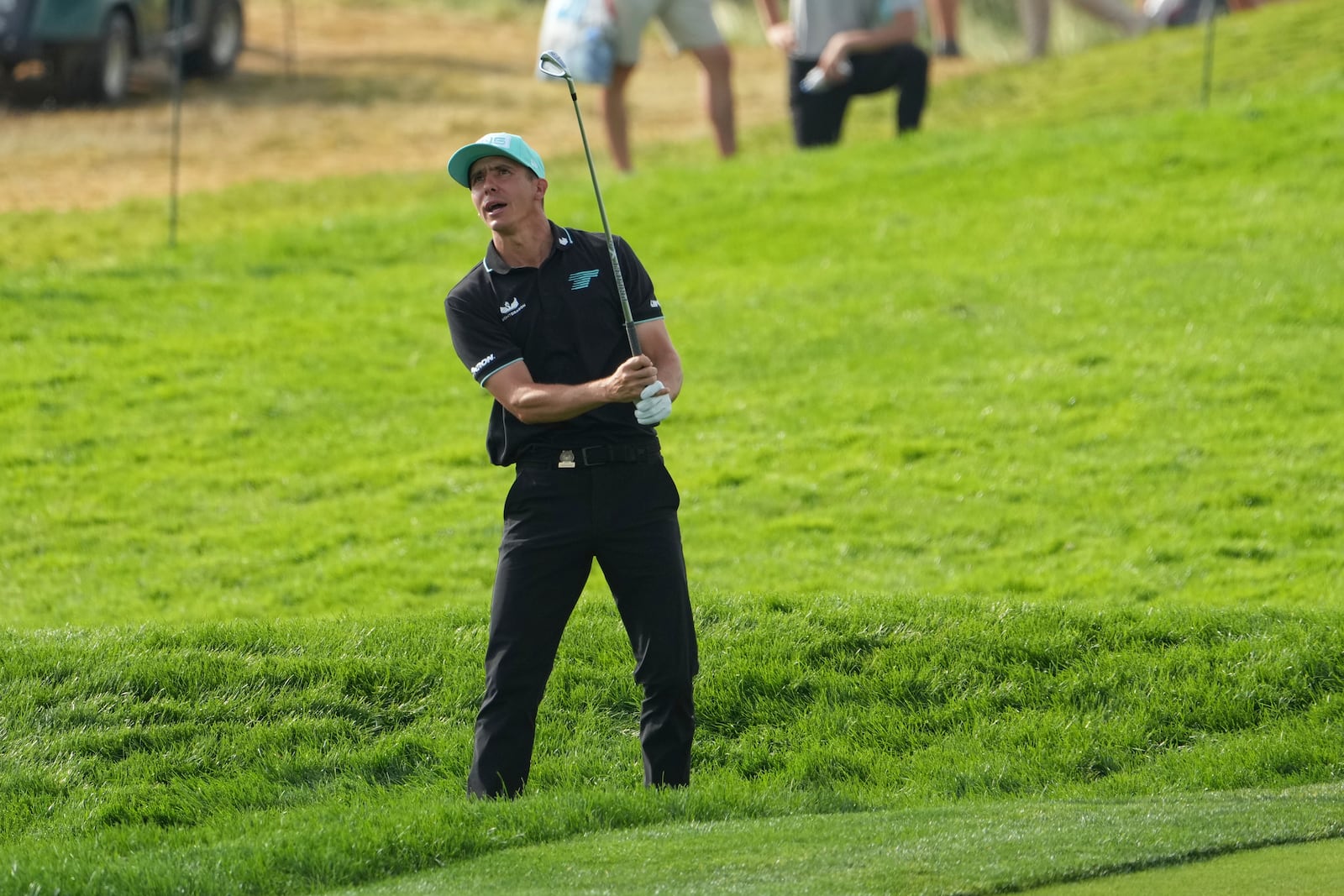 Carlos Ortiz, of Mexico, watches his shot out of the rough on the 18th hole during the third round of the U.S. Open golf tournament at Oakmont Country Club Saturday, June 14, 2025, in Oakmont, Pa. (AP Photo/Gene J. Puskar)