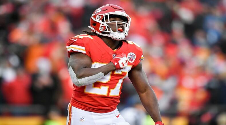 Kansas City Chiefs running back Kareem Hunt (27) celebrates after scoring a touchdown in the first quarter against the Tennessee Titans on Saturday, Jan. 6, 2018, during the AFC Wild Card playoff game at Arrowhead Stadium in Kansas City, Mo. (David Eulitt/Kansas City Star/TNS)