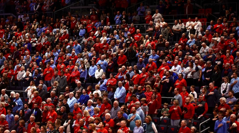 Dayton fans stand for the national anthem before a game against Fordham on Wednesday, Dec. 31, 2025, at UD Arena. David Jablonski/Staff