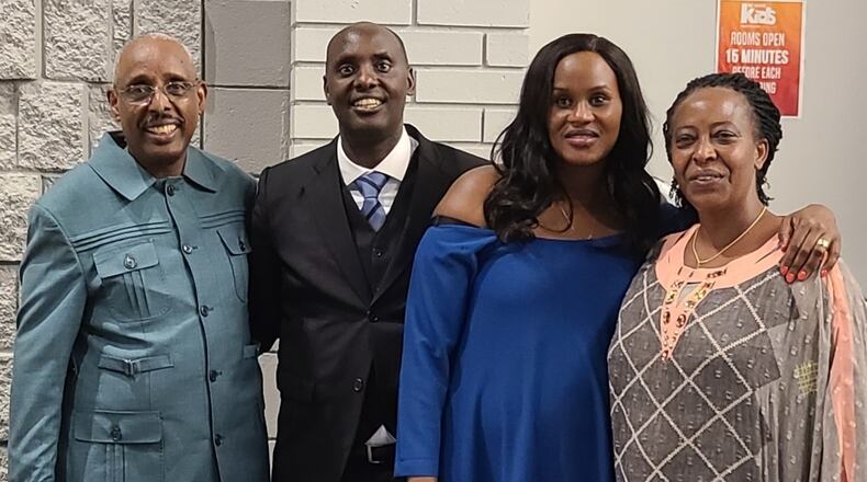 From left:  The Rev. Peter Mutima from Maine, the Rev. Laurent Muvunyi of Dayton, his wife, Nicole Muvunyi, and the Rev. Muke Nagaju from Rwanda at Muvunyi's ordination July 25 at Living Hope Church in Centerville. CONTRIBUTED
