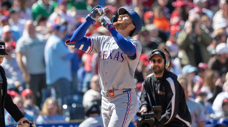 Texas Rangers' Brandon Nimmo celebrates his two run homer in the third inning of a baseball game against the Philadelphia Phillies, Sunday, March 29, 2026, in Philadelphia. (AP Photo/Laurence Kesterson)