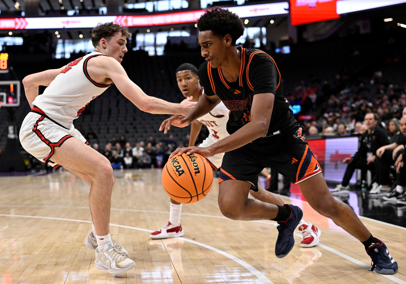 Chatsworth High School basketball player Alijah Arenas, right, is defended by a Jesuit player in the second half of a boys CIF State Division II championship basketball game in Sacramento, Saturday, March 15, 2025. (Keith Birmingham/The Orange County Register via AP)
