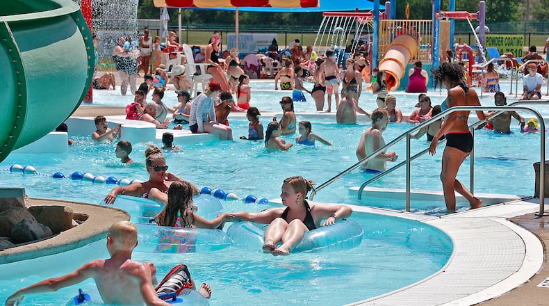 Splash Zone Aquatic Center on Eagle City Road was overflowing with swimmers looking for some relief from the 90 degree temperatures Friday, June 2, 2023. BILL LACKEY/STAFF