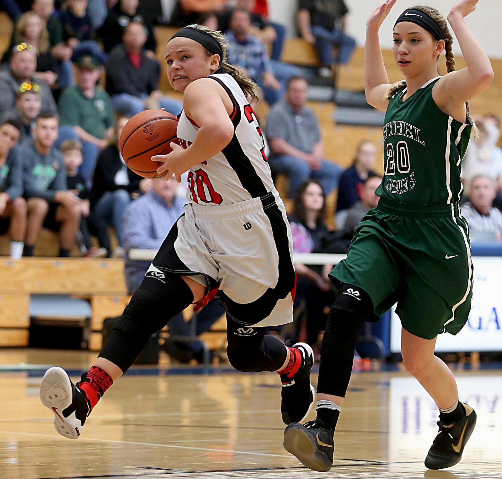 Madison guard Kenzi Saunders charges to the hoop past Bethel guard Emily Crase during Saturday’s Division III sectional contest at Franklin Monroe. CONTRIBUTED PHOTO BY E.L. HUBBARD