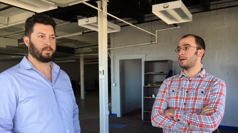 Mile Two LLC partners Jeff Graley, left, and Jorge Sanchez are at home in downtown Dayton’s newly named “Innovation District,” off East Second Street near the Tech Town business park. THOMAS GNAU/STAFF