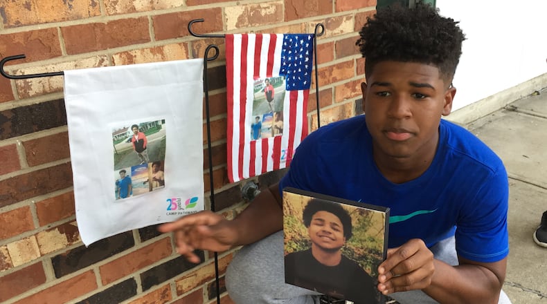 Hodges Clemmons, 15, and his 8-year-old sister Ziah made lawn displays memorializing their older brother Antoine Jones who was shot to death last year. Their mother Carolyn Williams was denied victims compensation funds because Jones was allegedly involved in drug dealing when he was killed. She says she and Jones’ siblings are also victims, and should qualify for help with counseling costs and burial costs.