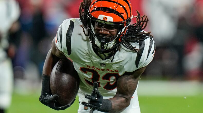 Cincinnati Bengals cornerback Tre Flowers (33) runs after his interception off Tampa Bay Buccaneers quarterback Tom Brady during the second half of an NFL football game, Sunday, Dec. 18, 2022, in Tampa, Fla. (AP Photo/Chris O'Meara)