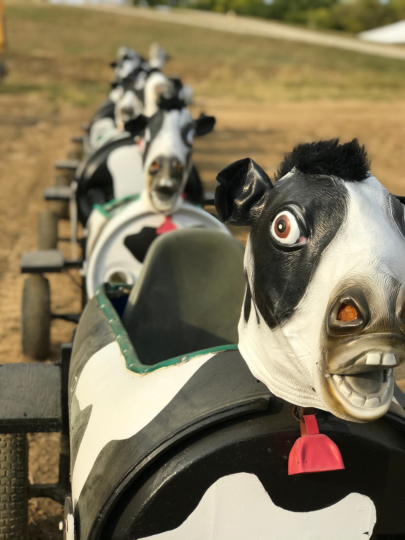 A kiddie ride where little ones sit in cow-shaped cars pulled by an ATV is part of the fun on the farm at McMonigle Farms near Franklin. CONTRIBUTED