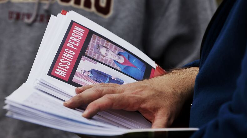 Doug Coffin hands out maps Wednesday, March 30, 2022 as people gather at Prater Wildlife Area on Reily Millville Road to search for Coffin's 26-year-old autistic son, Nathaniel Coffin, who has been missing since March 22. NICK GRAHAM/STAFF