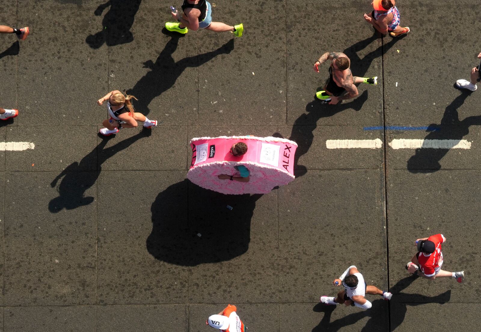 A general view from inside the viewing window above Tower Bridge of the mass participation race during the TCS London Marathon, Sunday April 27, 2025. (Jonathan Brady/PA via AP)