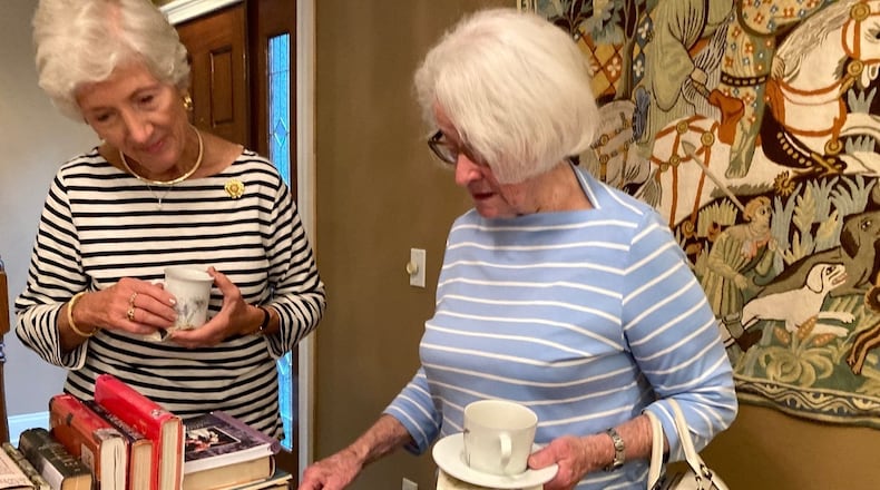 Susan Harris Wagner (left) and Mary Lou Van Tassel check out the non-fiction. Both live in Kettering. Photo by Staff writer Meredith Moss.