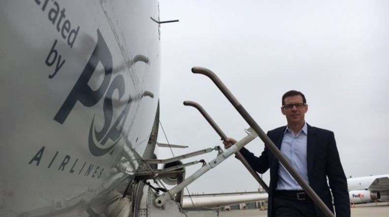 PSA Airlines President Dion Flannery, on the steps of a Bombardier CRJ aircraft.