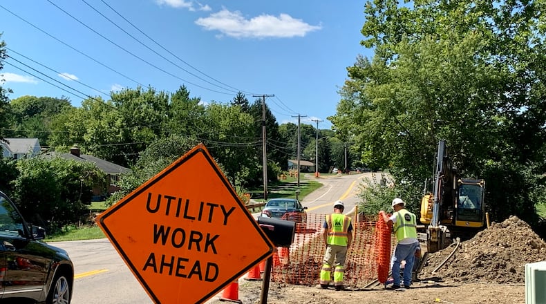 Construction workers on Shakertown Road in Beavercreek. The city's road widening project may begin as early as this fall. LONDON BISHOP/STAFF