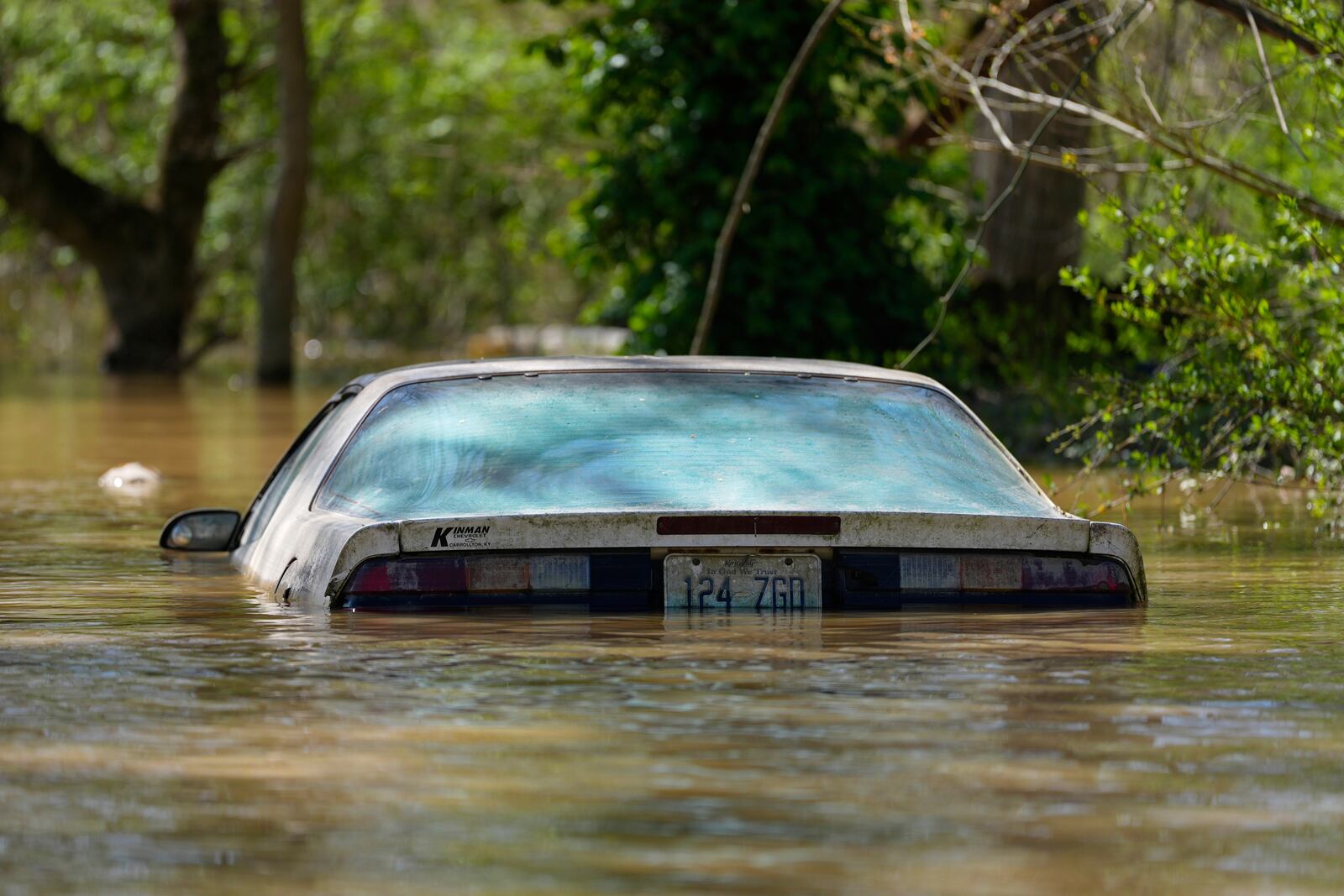 A car is flooded by the Kentucky River in Lockport, Ky., Tuesday, April 8, 2025. (AP Photo/Carolyn Kaster)