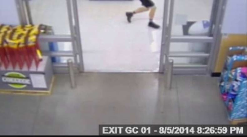 Beavercreek police officer Sean Williams moves through Walmart during the Aug. 5, 2014 incident in which Williams shot and killed John Crawford III.
