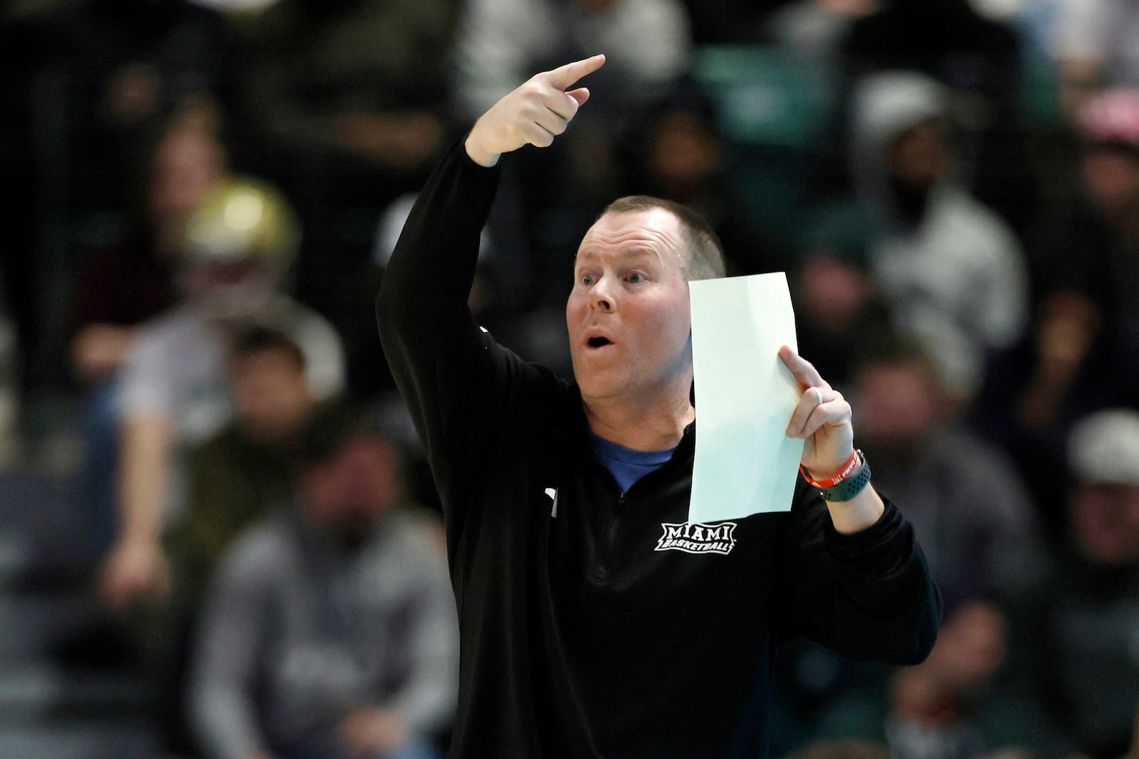 Miami (OH) head coach Travis Steele directs his team during the first half of an NCAA college basketball game against the Eastern Michigan, Tuesday, Feb. 24, 2026, in Ypsilanti, Mich. (AP Photo/Duane Burleson)