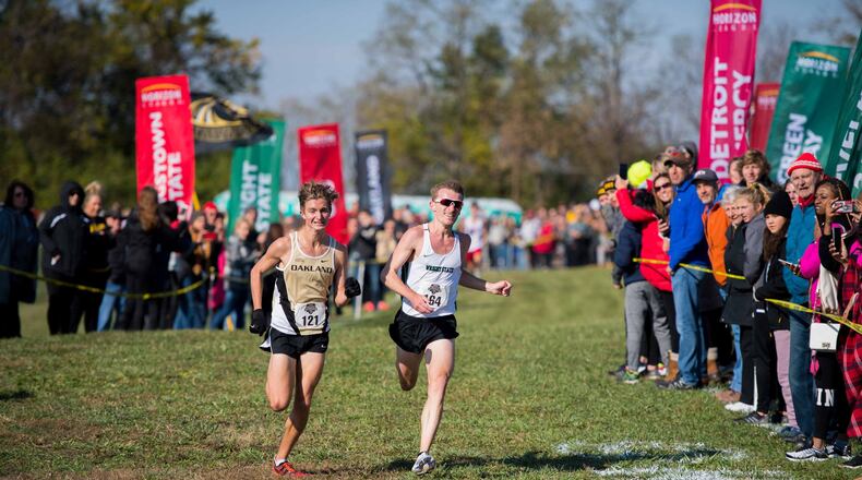 Wright State’s Nathan Dunn (right) battles Oakland’s Connor Goetz to the finish of the Horizon League cross country championships. Joseph Craven/WRIGHT STATE ATHLETICS