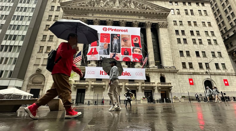 FILE - Banners for Pinterest, displayed to mark the fifth anniversary of the company's listing, hang on the front of the New York Stock Exchange in New York, May 15, 2024. (AP Photo/Peter Morgan, File)