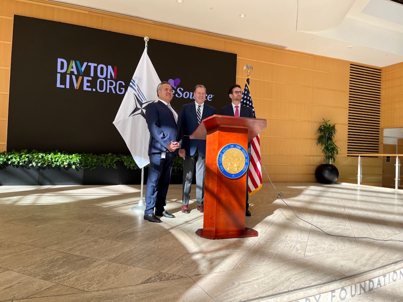U.S. Rep. Mike Turner, R-Dayton, center, after discussing plans Wednesday for next May's expected NATO Spring Parliamentary Assembly visit to Dayton. On Turner's right: Erhardt Preitauer, president and CEO of CareSource. On his left, Gabriel van Aalst, president and CEO of Dayton Live. THOMAS GNAU/STAFF