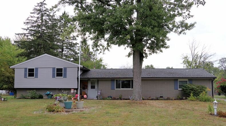 Listed for $350,000 by eXp Realty, the vinyl-and-brick, tri-level at 6220 Garber Road in Clayton has about 1,945 square feet of living space. The house sits well off the roadway on a 1.15-acre property. CONTRIBUTED.
