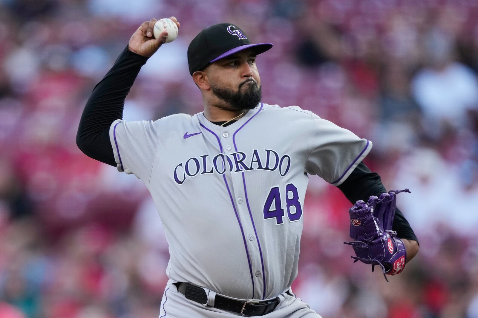 Colorado Rockies pitcher Germán Márquez throws during the first inning of a baseball game against the Cincinnati Reds in Cincinnati, Friday, July 11, 2025. (AP Photo/Carolyn Kaster)
