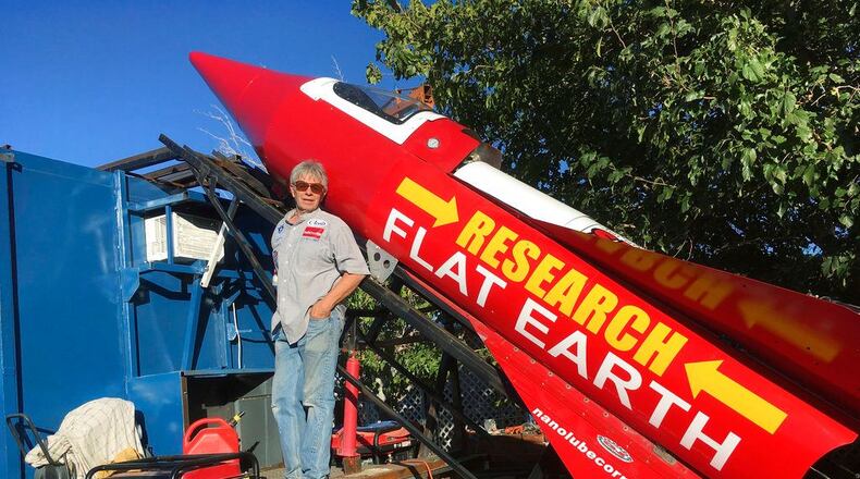 In this Wednesday, Nov. 15, 2017, photograph, daredevil/limousine driver Mad Mike Hughes is shown with with his steam=powered rocket constructed out of salvage parts on a five-acre property that he leases in Apple Valley, Cal. Hughes plans to launch his homemade contraption on Saturday near the ghost town of Amboy, Cal., at a speed of roughly 500 miles-per-hour. (Waldo Stakes/HO courtesy of Mad Mike Hughes via AP)