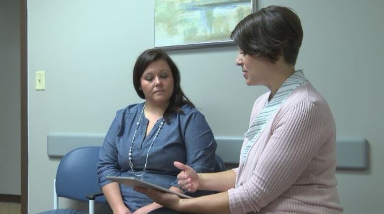 On the left, Kari Clement, quality improvement coordinator, Providence Medical Group, talks about the Healthii app with Stacy Sheldon, president and co-founder, Healthii and POMEIT. STAFF