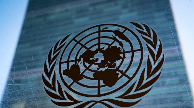 FILE - The symbol of the United Nations is displayed outside the Secretariat Building, Feb. 28, 2022, at United Nations Headquarters. (AP Photo/John Minchillo, File)