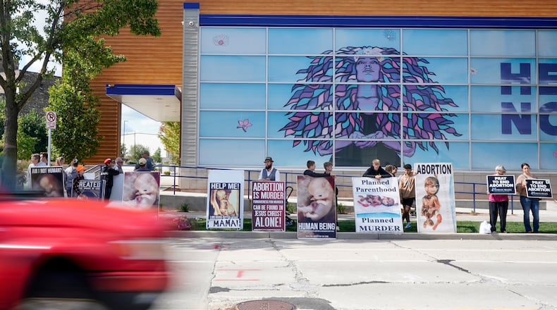 FILE - Protesters are seen outside Planned Parenthood, Sept. 18, 2023, in Milwaukee. (AP Photo/Morry Gash, File)
