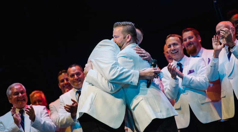 Tony Heston (left) proposes to Michael Reiger at the Gar Men’s Chorus concert last weekend. Submitted photo by Briana Snyder.