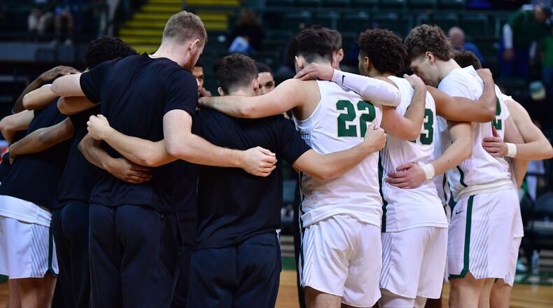 Members of the Wright State men's basketball team huddle before a game earlier this season. Wright State Athletics photo