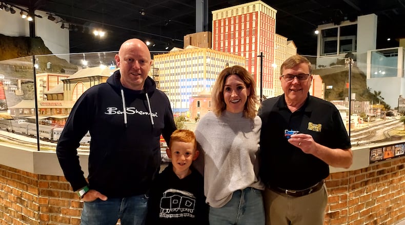 EnterTRAINment Junction owner Don Oeters, right, poses with Victoria and Andrew Royds and their son, Enzo. The Royds family came to West Chester Twp. from New Zealand to see the venue. CONTRIBUTED