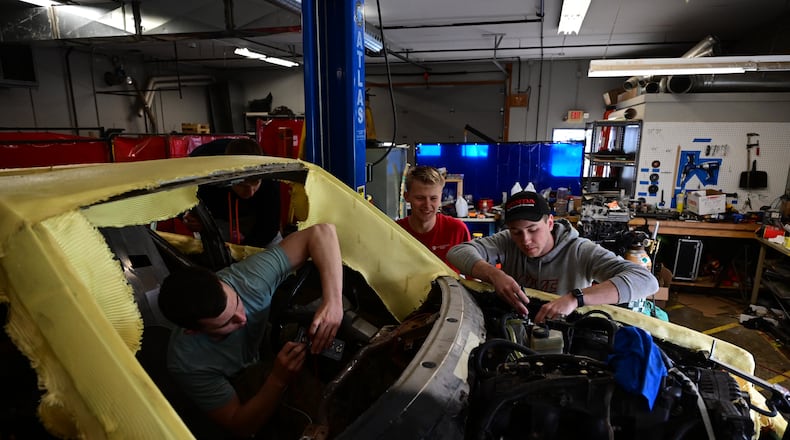 Will Hanak, John Thomson, and Tim Junker are in Cedarville's engineering lab to work on the refurbished Mercedes. | CONTRIBUTED