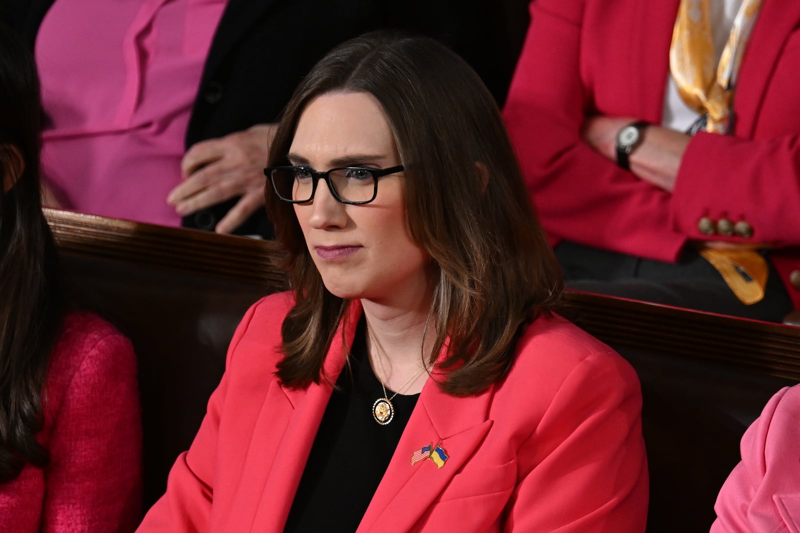 
                        FILE — Rep. Sarah McBride (D-Del.) listens during President Donald Trump’s address to a joint session of Congress at the Capitol in Washington, on Tuesday, March 4, 2025. Representative Keith Self of Texas insisted on calling Representative Sarah McBride, the first openly transgender member of Congress, “Mr. McBride,” and adjourned the session when challenged about it. (Kenny Holston/The New York Times)
                      