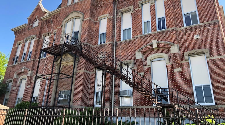 The vacant Longfellow school complex on the 200 block of Salem Avenue. Developers want to convert it into housing and build new apartments. CORNELIUS FROLIK / STAFF